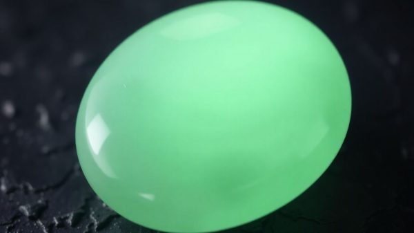 Polished green jade stone with soft luminescence.